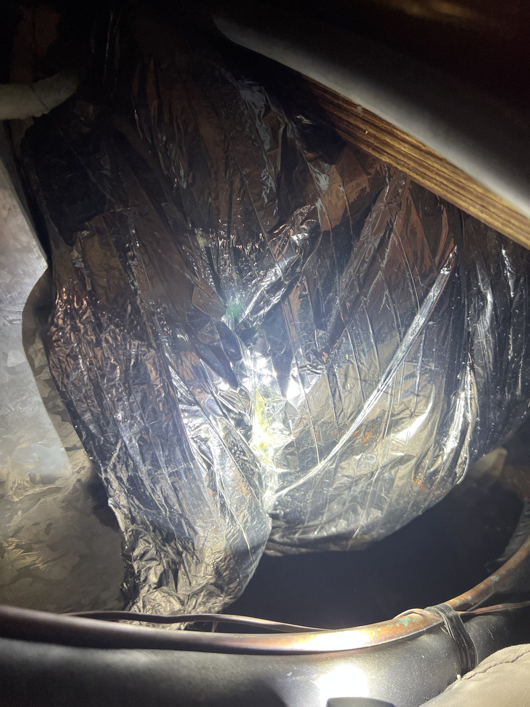 Ductwork and vapor barrier in a crawlspace during a Peak inspection