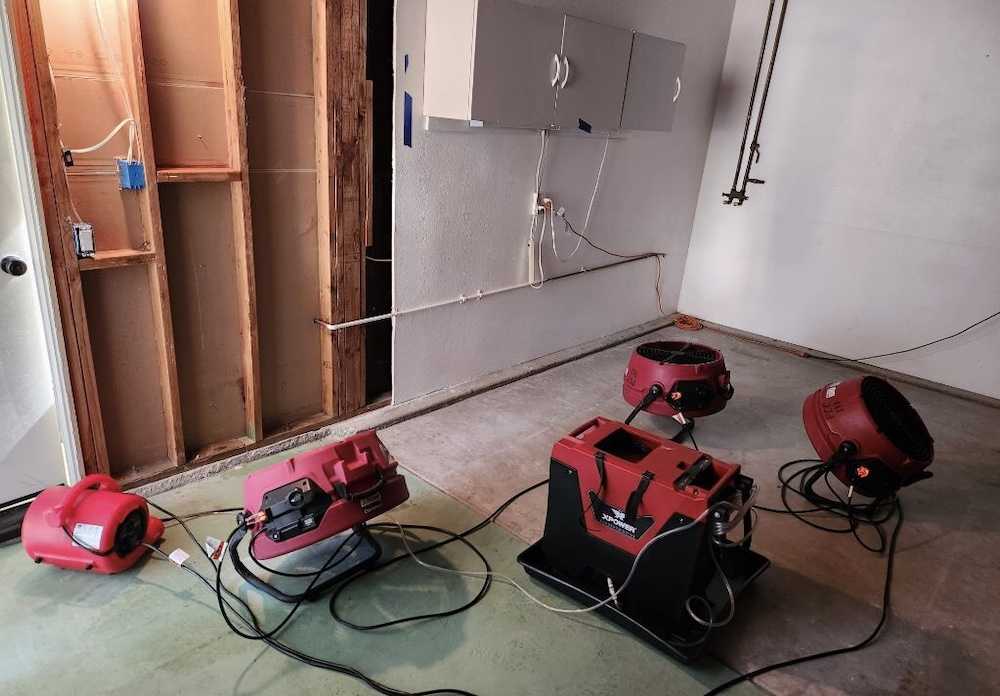 Air movers and dehumidification equipment placed on a Peak drying job