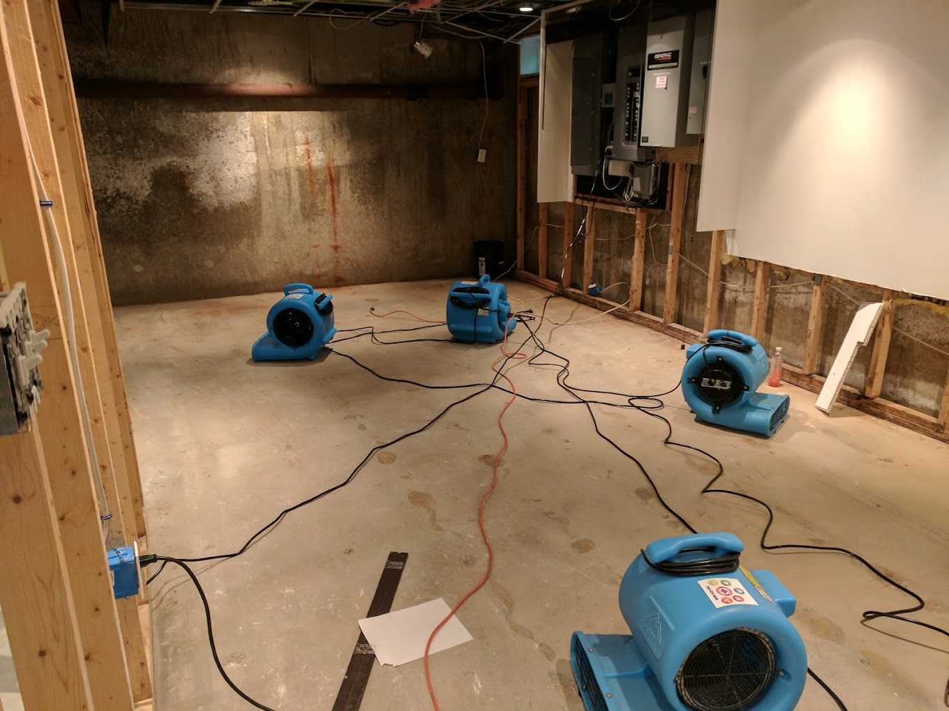 Structural drying equipment running in a basement on a Peak job