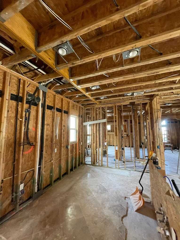 Exposed framing during controlled demolition on a Peak remediation job